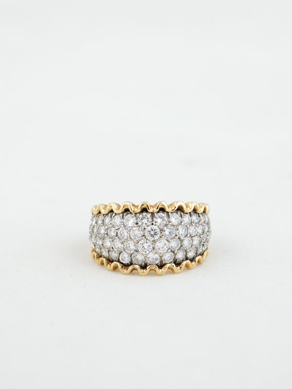 Gold and diamond ring on a white background