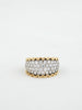 Gold and diamond ring on a white background