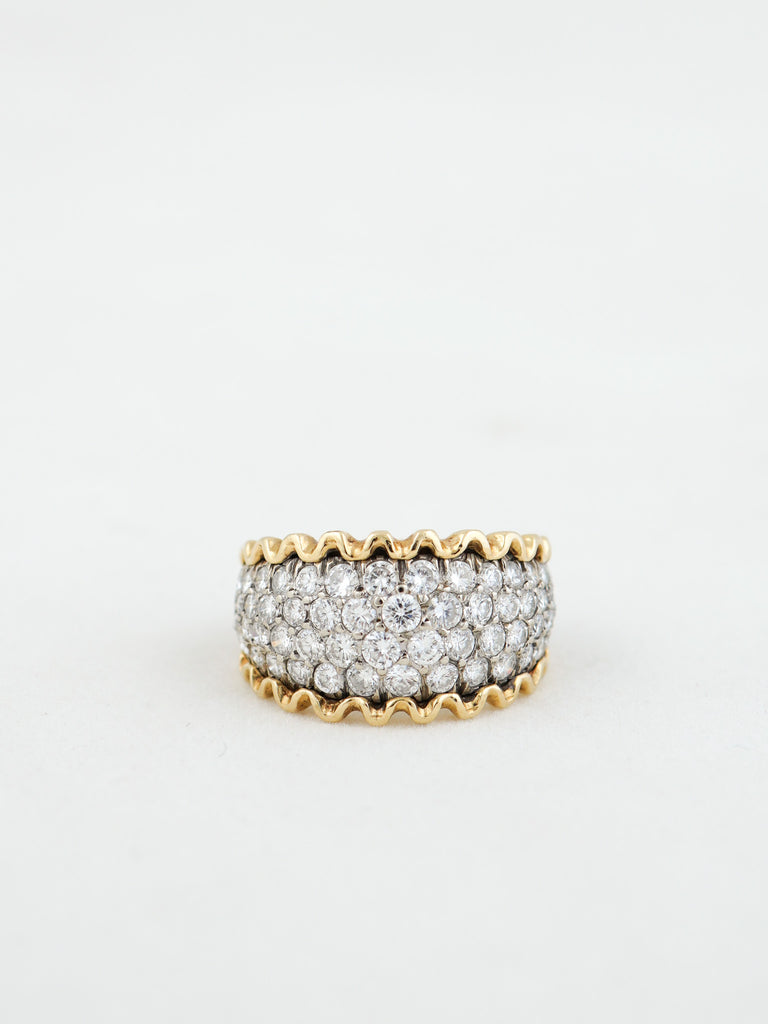 Gold and diamond ring on a white background